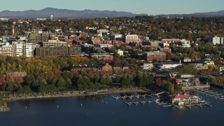 DX0002_224_050 - 5.7K aerial stock footage approach park and city building near a marina in downtown, Burlington, Vermont