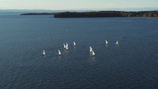 DX0002_224_053 - 5.7K aerial stock footage orbiting a group of sailboats on Lake Champlain, Burlington, Vermont