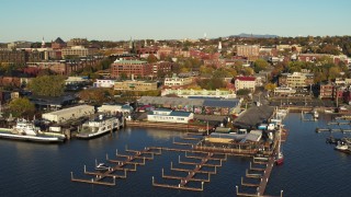 DX0002_224_057 - 5.7K aerial stock footage orbit around a marina and city buildings in downtown, reveal second marina, Burlington, Vermont
