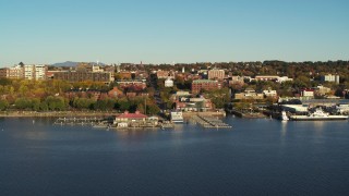 DX0002_224_060 - 5.7K aerial stock footage of orbiting city buildings near marinas, Burlington, Vermont