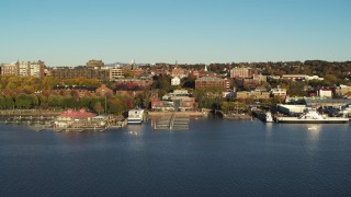 DX0002_224_061 - 5.7K aerial stock footage of city buildings near a marina, Burlington, Vermont