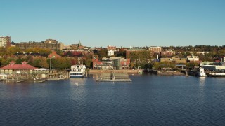 DX0002_224_062 - 5.7K aerial stock footage of approach a marina and city buildings in downtown, Burlington, Vermont