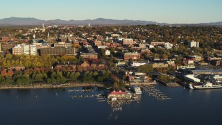 DX0002_224_066 - 5.7K aerial stock footage of a wide orbit of downtown buildings and marina, Burlington, Vermont