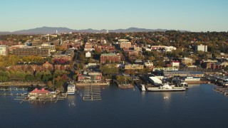 DX0002_224_069 - 5.7K stock footage aerial video orbit around downtown buildings and Lake Champlain marinas, Burlington, Vermont