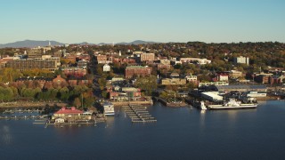 DX0002_224_071 - 5.7K stock footage aerial video orbit downtown buildings, Waterfront Park and Lake Champlain marinas, Burlington, Vermont