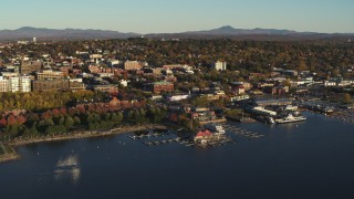 DX0002_224_074 - 5.7K aerial stock footage an orbit of downtown's city buildings behind a Lake Champlain marina, Burlington, Vermont
