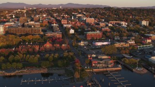 DX0002_225_010 - 5.7K stock footage aerial video orbit buildings in downtown at sunset, Burlington, Vermont