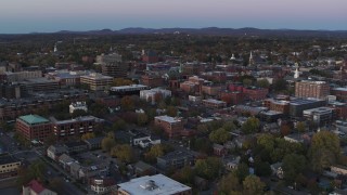 DX0002_225_027 - 5.7K stock footage aerial video flying away from downtown office buildings at twilight, Burlington, Vermont