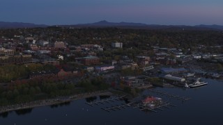 DX0002_225_042 - 5.7K aerial stock footage approach and orbit downtown and the lakeside marinas at twilight, Burlington, Vermont