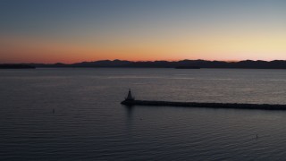 DX0002_226_004 - 5.7K aerial stock footage stationary view of Lake Champlain lighthouse at twilight, Burlington, Vermont