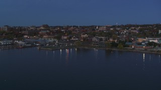 DX0002_226_008 - 5.7K aerial stock footage fly away from the downtown area at twilight, seen from the lake, Burlington, Vermont