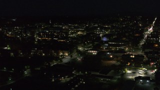 DX0002_226_034 - 5.7K stock footage aerial video circling the downtown area and College Street lit up for nighttime, Burlington, Vermont