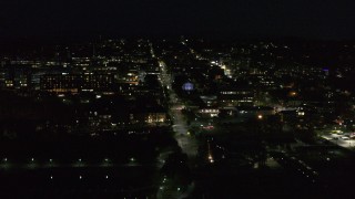 DX0002_226_035 - 5.7K aerial stock footage orbit the downtown area around College Street lit up for nighttime, Burlington, Vermont