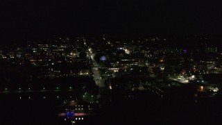 DX0002_226_049 - 5.7K stock footage aerial video of a view of city buildings in downtown at night, Burlington, Vermont