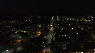 DX0002_226_051 - 5.7K aerial stock footage of Battery Street and office buildings in downtown at night, Burlington, Vermont