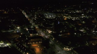 DX0002_226_057 - 5.7K aerial stock footage fly around office buildings by Battery Street at night, Burlington, Vermont