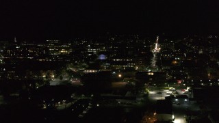 DX0002_226_062 - 5.7K aerial stock footage orbit the downtown area near Main Street at night, Burlington, Vermont