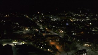 DX0002_226_064 - 5.7K aerial stock footage fly away from the downtown area near Battery Street at night and descend, Burlington, Vermont