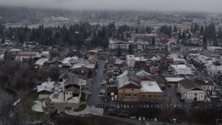 DX0002_227_009 - 5.7K aerial stock footage rooftops dusted with snow in the small town, Leavenworth, Washington