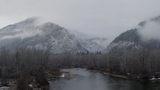 DX0002_227_015 - 5.7K aerial stock footage ascend from river to reveal Leavenworth, Washington