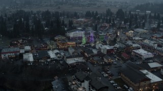 DX0002_227_041 - 5.7K aerial stock footage circling above town while focused on Christmas trees, Leavenworth, Washington