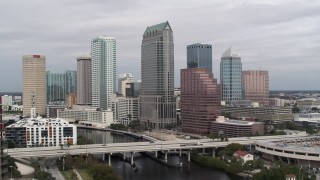 DX0003_229_003 - 5.7K aerial stock footage of flying away from tall skyscrapers in Downtown Tampa, Florida