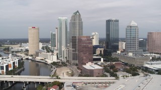 DX0003_229_006 - 5.7K aerial stock footage of flying away from skyscrapers, Downtown Tampa, Florida