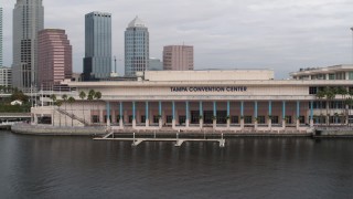 DX0003_229_010 - 5.7K aerial stock footage a low orbit of the Tampa Convention Center, Downtown Tampa, Florida