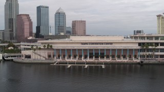 DX0003_229_011 - 5.7K aerial stock footage circling the Tampa Convention Center, Downtown Tampa, Florida