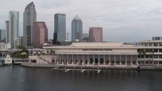 DX0003_229_013 - 5.7K aerial stock footage orbit the convention center, skyline in background, Downtown Tampa, Florida