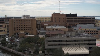 DX0003_229_016 - 5.7K aerial stock footage of orbiting a hospital in Tampa, Florida
