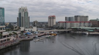DX0003_229_027 - 5.7K aerial stock footage approach condo complexes by a channel in Tampa, Florida