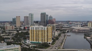 DX0003_229_030 - 5.7K aerial stock footage flyby condo complex with view of Downtown Tampa, Florida