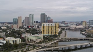 DX0003_229_036 - 5.7K aerial stock footage the city skyline seen while flying away from condo complex, Downtown Tampa, Florida