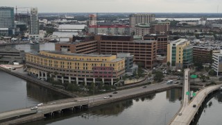 DX0003_230_003 - 5.7K aerial stock footage a reverse view of a waterfront hospital in Tampa, Florida