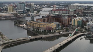 DX0003_230_004 - 5.7K aerial stock footage reverse view of bridges and a waterfront hospital in Tampa, Florida