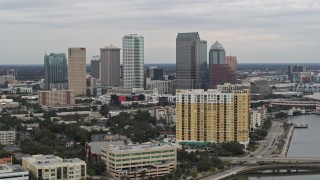 DX0003_230_010 - 5.7K aerial stock footage of the skyline, seen while passing condos, Downtown Tampa, Florida