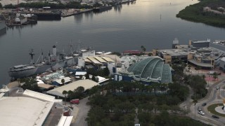 DX0003_230_032 - 5.7K aerial stock footage of orbiting a warship museum and aquarium in Tampa, Florida