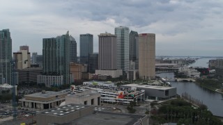 DX0003_231_018 - 5.7K aerial stock footage ascend and orbit skyscrapers by the river, Downtown Tampa, Florida