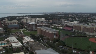 DX0003_231_022 - 5.7K aerial stock footage descend and fly away from the University of Tampa campus, Florida