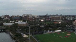 DX0003_231_023 - 5.7K aerial stock footage approach and ascend toward the University of Tampa campus, Florida