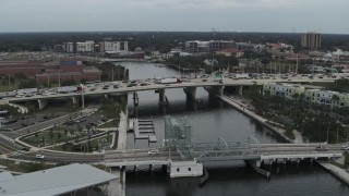 DX0003_231_028 - 5.7K aerial stock footage orbit traffic on a bridge spanning the river in Tampa, Florida
