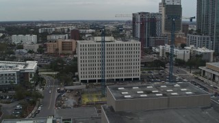 DX0003_231_031 - 5.7K aerial stock footage of orbiting the Times Building in Downtown Tampa, Florida