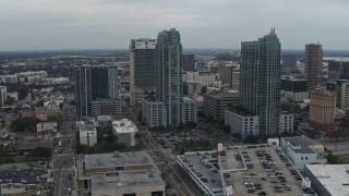 DX0003_231_036 - 5.7K aerial stock footage of a reverse view of a pair of high-rise buildings in Downtown Tampa, Florida