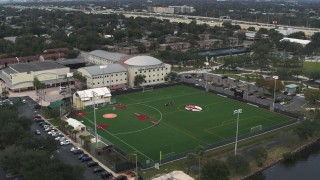 DX0003_231_039 - 5.7K aerial stock footage ascend and orbit the Tampa Preparatory School campus, Tampa, Florida