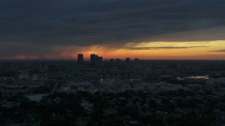 DX0003_231_048 - 5.7K aerial stock footage a reverse view of the Downtown Tampa skyline at sunset, Florida
