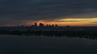 DX0003_231_050 - 5.7K aerial stock footage a view of the Downtown Tampa skyline from the bay at sunset, Florida