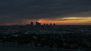 DX0003_231_055 - 5.7K aerial stock footage slowly fly away from Downtown Tampa skyline at sunset, Florida