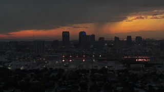 DX0003_232_009 - 5.7K aerial stock footage of slowly flying away from the Downtown Tampa skyline at twilight, Florida