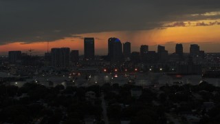 DX0003_232_012 - 5.7K aerial stock footage a reverse view of the Downtown Tampa skyline at twilight, Florida